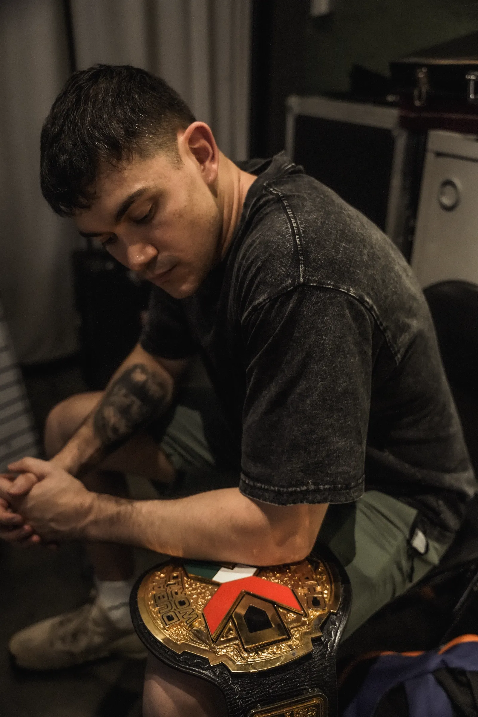 Handsome Jay backstage, taping up beside his championship belt