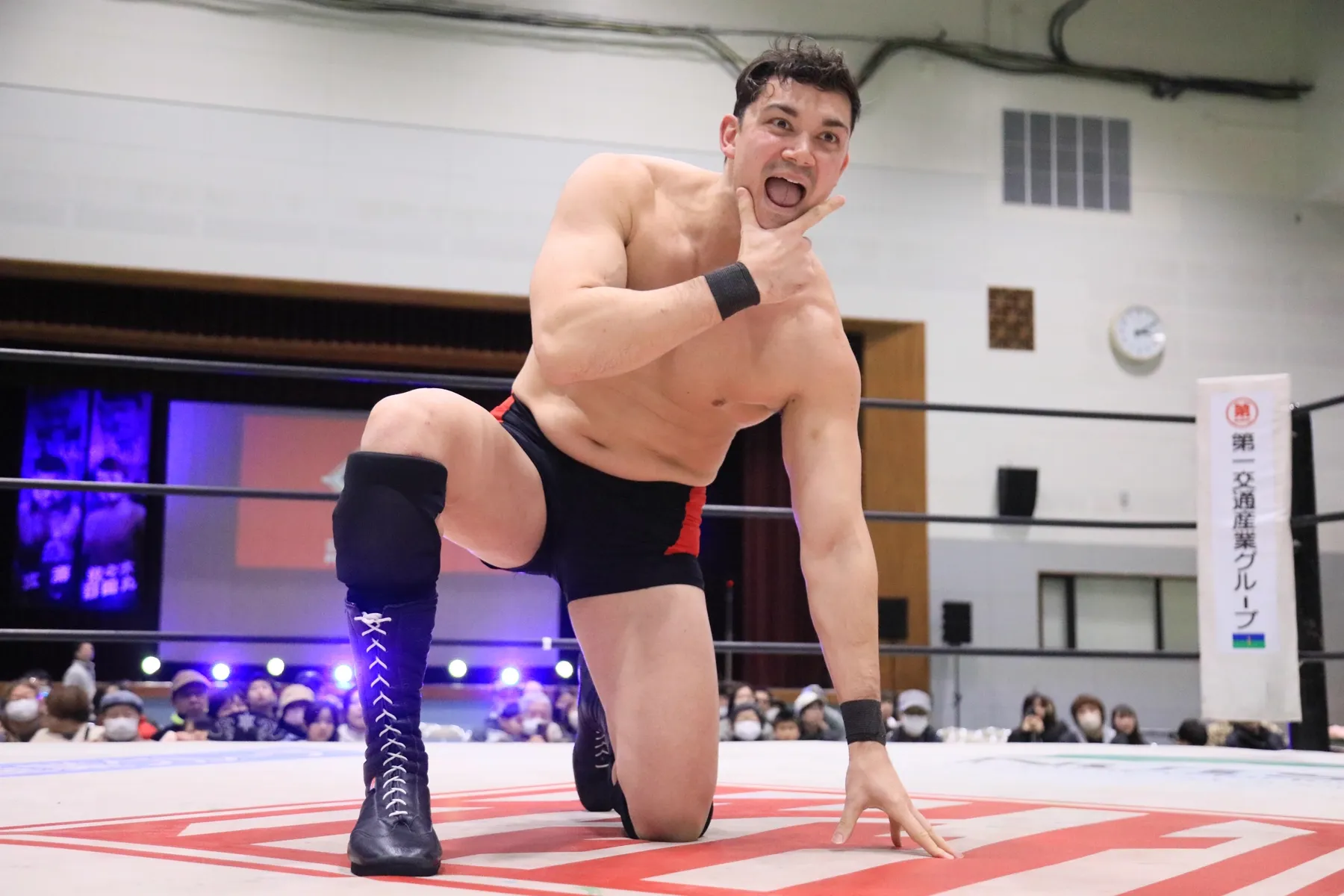 Handsome Jay posing on one knee in the ring